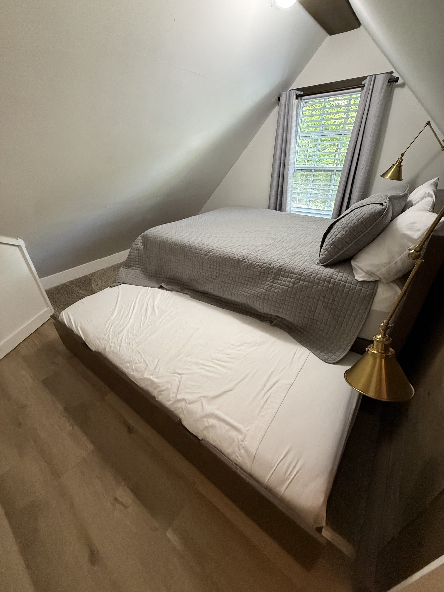 Lofted bedroom — full bed with twin trundle pulled out