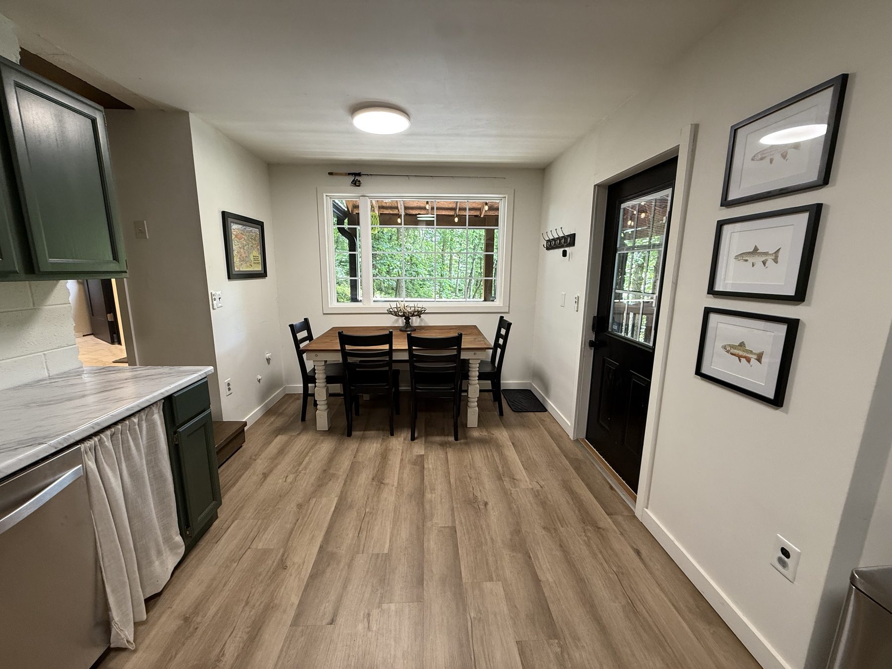 Kitchen and dining area with forest view