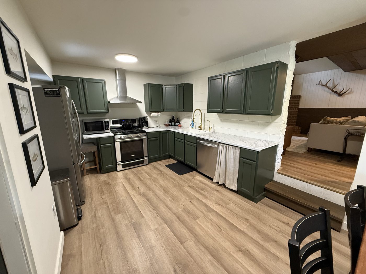 Full kitchen with green cabinets
