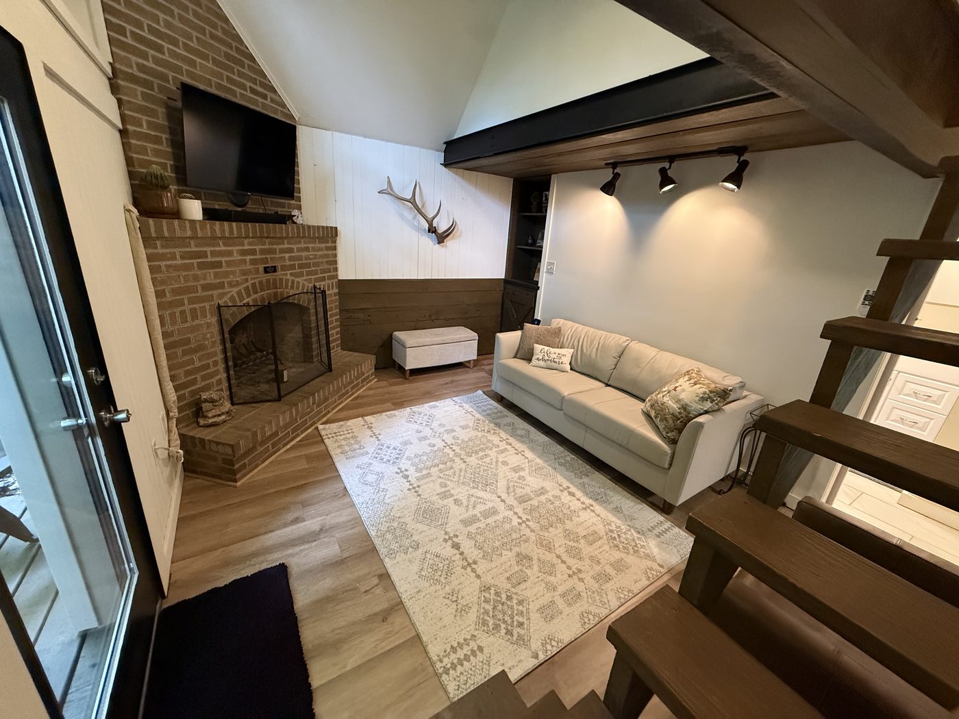 Living room fireplace and antlers