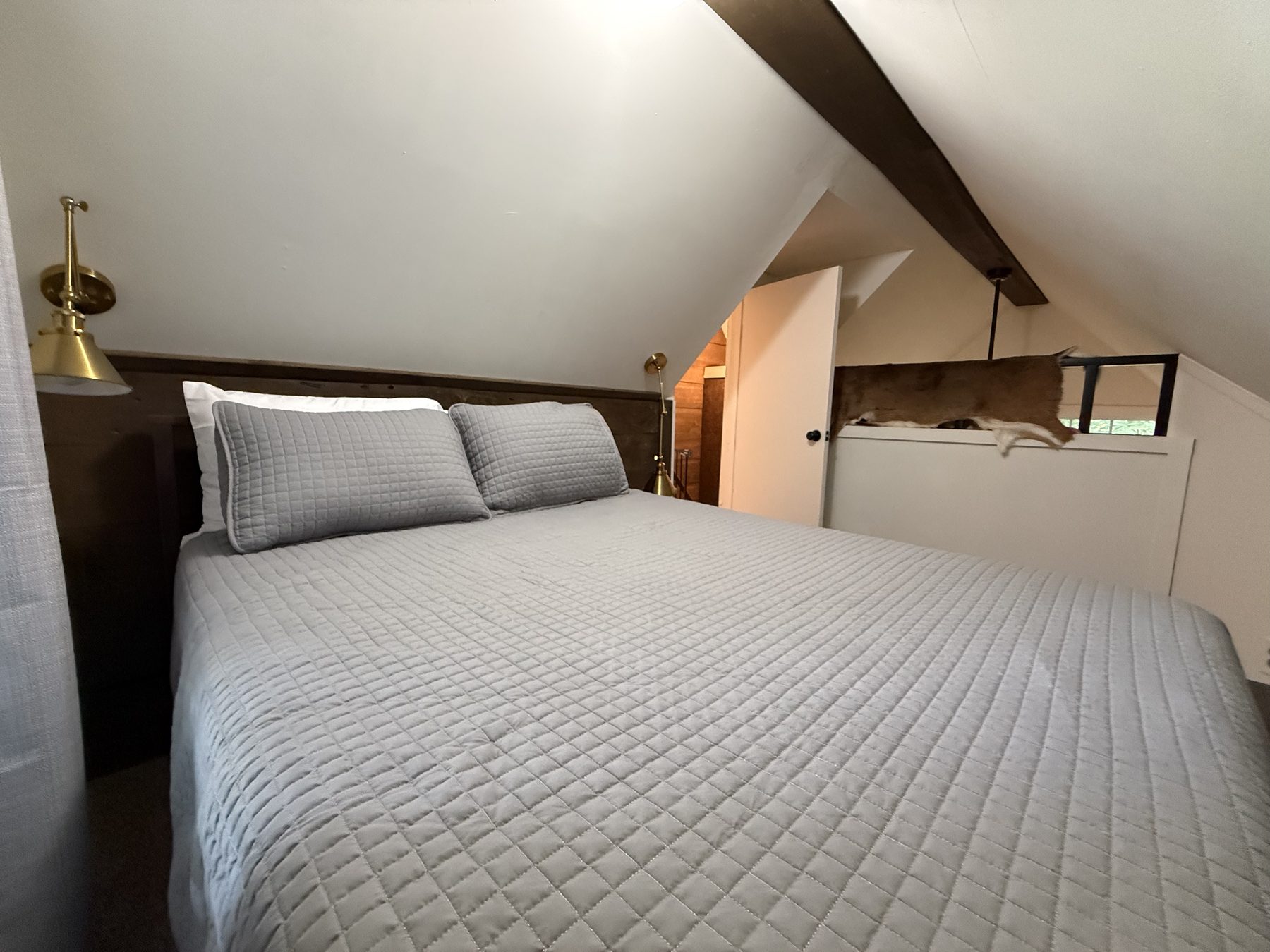 Lofted bedroom — full bed